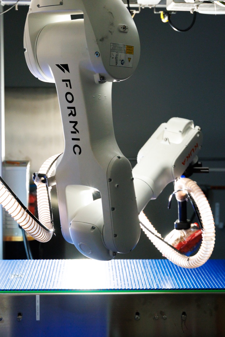 Formic-branded Talos case-packer arm in studio, the kind of system Cortex orchestrates across the fleet