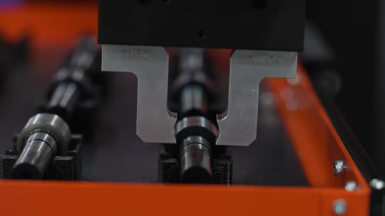 Finished shafts squared up in the tray at the end of a run